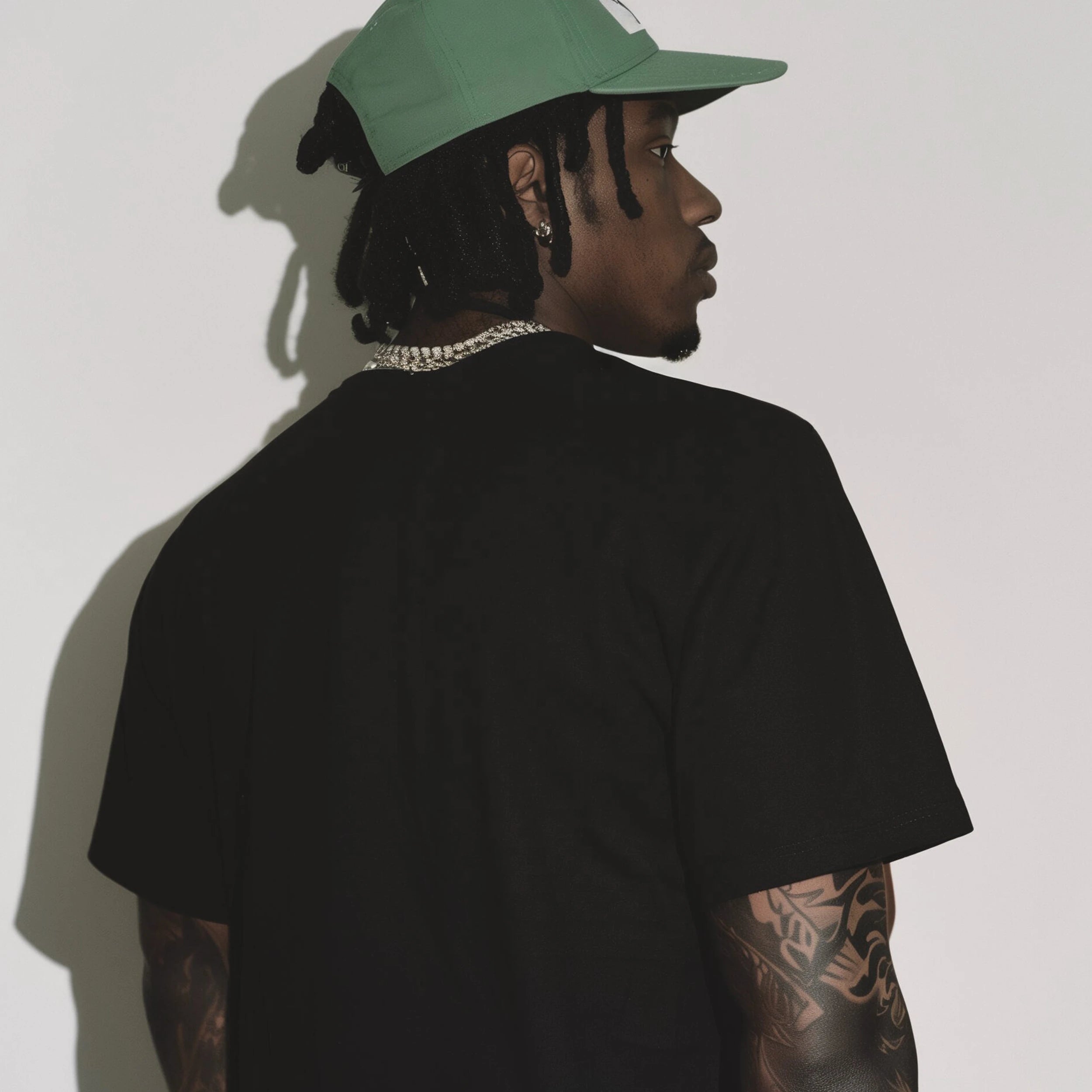 A man with his back turned, looking straight ahead