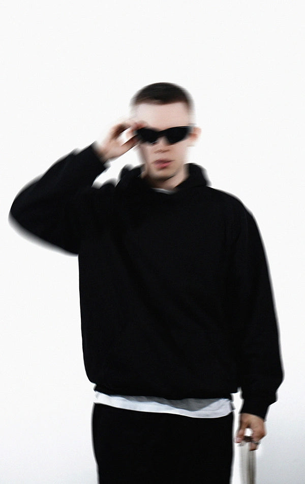 Guy in black clothes wearing sunglasses